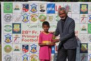 A student from Godawari Residential School receiving the most Promising Player award at the 28th Fr. Moran Memorial Football Tournament.