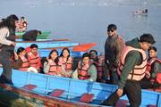 Students enjoying a scenic boat ride on Phewa Lake during an educational tour to Pokhara.