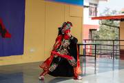 Students are showcasing vibrant cultural performances during the Chinese New Year celebration at the school event.