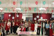 Students celebrate the festive spirit and camaraderie during a vibrant Christmas Fest celebration.