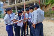 Civil engineering students engaging in hands-on surveying practice to gain essential practical field experience.