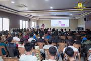 Students gather for an informative orientation session in the hall.