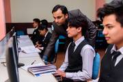 Students enhancing their technical proficiency through hands-on practical sessions in the computer lab.
