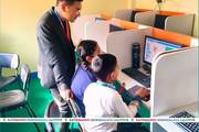 Students of Kathmandu Shikshalaya engaged in a computer lab session.