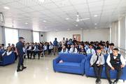 Students attending an informative session on cyber security awareness to enhance their digital safety knowledge.