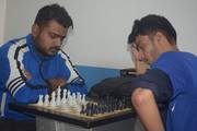 Students demonstrating focus and strategic thinking during a competitive chess match.