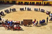 Students participating in a competitive inter-house quiz competition as part of the school's extra-curricular activities.