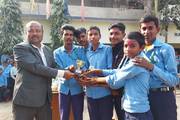 Winners of the essay and painting competition receiving awards for their achievements.