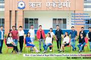 A group of students posing in front of the academic building, which offers specialized programs in law and management within a peaceful learning environment.