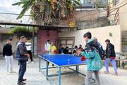 Beyond the classroom: Students enjoying a friendly game of table tennis.