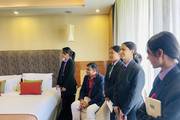 Hotel management students during a practical training session.