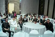 Students capturing a memorable group moment during a grand celebratory event.