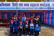 Students with their medal and certificate during a school ceremony.