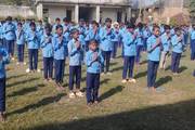 Students of Ram Janaki Secondary School are participating in their daily morning prayer session.