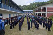 Students participate in the daily morning assembly and prayer session.
