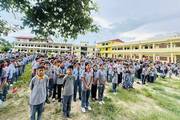 Students gathered in the assembly area during the daily morning prayer session.