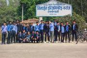 Students of Neelarjun Educational Consortium with signboard