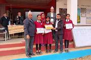 Adarsha Bal Secondary School awards prizes to painting competition winners.