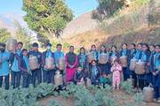 Plant Science students engaged in practical agricultural training at the school farm.