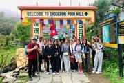 A group of students posing at a scenic viewpoint during the Ghorepani-Ghandruk trek.