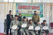 Winners receive medals and certificates at the Sports Meet ceremony.