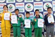 Kathmandu Shikshalaya students with their taekwondo championship medals and certificates.