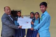Students receiving prizes and certificates for their achievements in the PEBL STEAM Challenge.