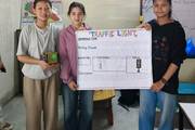 Students demonstrate practical STEM skills through their innovative Arduino-based traffic light project.