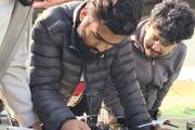 Students engage in advanced engineering and robotics through hands-on drone assembly and technical innovation.