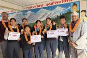 Students being honored with medals and certificates for their remarkable performance in the Presidential Running Shield competition.