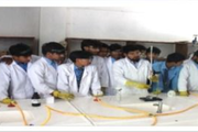 Students are conducting hands-on experiments in the school's laboratory.