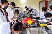 Students engage in hands-on practical learning during a science laboratory session.