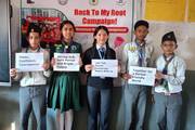 Scout team members raising awareness for menstrual hygiene management during the "Back to My Root Campaign."