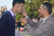 Sweetening the journey of success. A heartfelt moment between mentor and student, celebrating the bond that makes our school a family