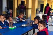 Small kids having their lunch at school