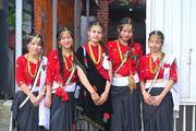 Students showcase Nepal's vibrant ethnic heritage by wearing traditional attire during a cultural program.