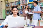Students utilize the quiet and resourceful library environment for their academic pursuits.