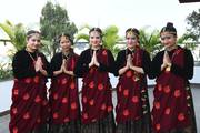 Students wearing cultural dress at Comos