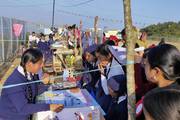Students showcasing their innovative projects during a science exhibition.