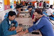 Students of Shivapuri College participating in a chess competition.
