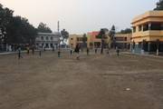 Students playing football at the school ground