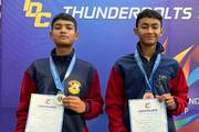 Students with medals and certificates after winning second and third positions in Taekwondo Sparring at the Thunderbolts Cup 2025