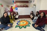 Students celebrate the vibrant festival of Tihar.
