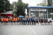 A moment of sportsmanship: Students and staff members at the Uniglobe Premier sports grounds.
