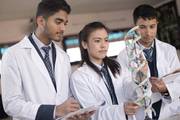 Students observing a biological DNA model at Dibya Deep Jyoti English Secondary School.