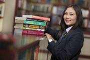 A student utilizing the library resources at Dibya Deep Jyoti English Secondary School.
