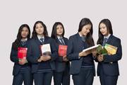 Students posing with their academic textbooks at Dibya Deep Jyoti English Secondary School.