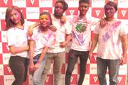 Students celebrating the vibrant festival of Holi.