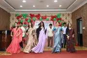Students performing on stage during the welcome and farewell program.