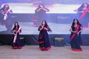 Students performing a vibrant cultural dance during the welcome and farewell program.